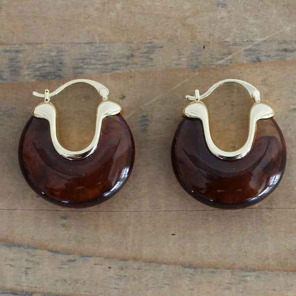 Tortoiseshell marbled resin hoop earrings with glossy brown finish and polished gold accents