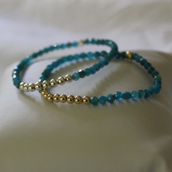 8 sterling silver or 14kt gold-filled beads with apatite beads strung on elastic. Designed by Margie Edwards Jewelry
