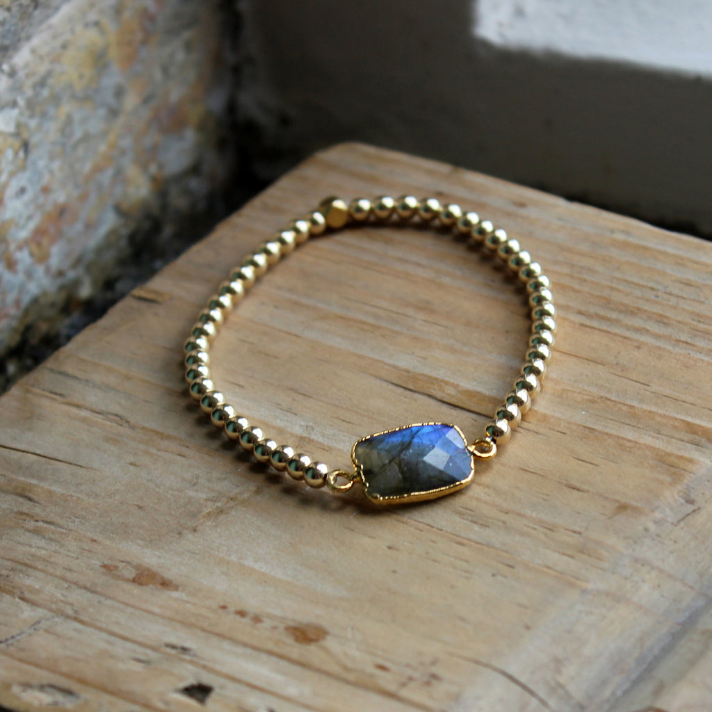 Labradorite stone in the middle with 14kt gold-filled beads strung on elastic designed by Margie Edwards Jewelry