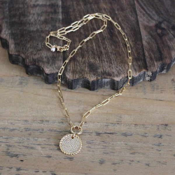 Gold paperclip chain with an enhancer and circle pendant with crystal inset,  design by Margie Edwards Jewelry 